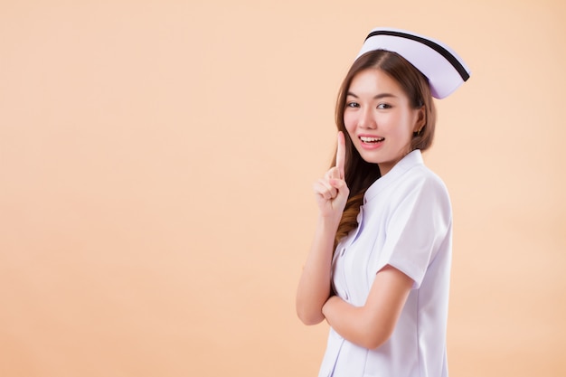 Asian nurse pointing one finger up