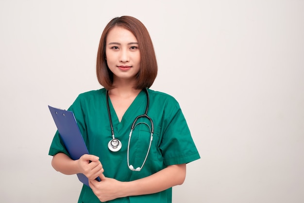 Asian nurse woman with a folder , isolated on white 