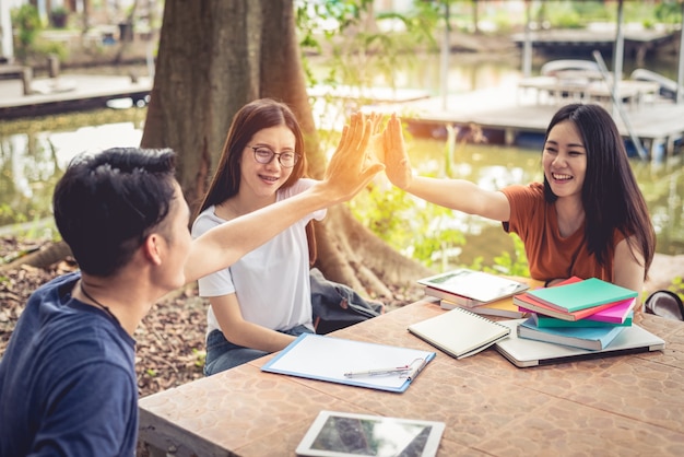 Asian people doing high five for start up new project