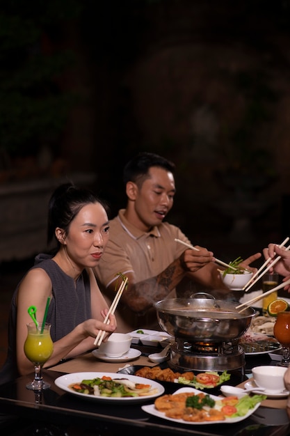 Asian people having dinner party