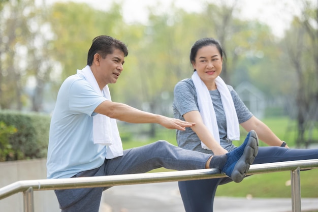 Asian people older couple retirement workout in city park