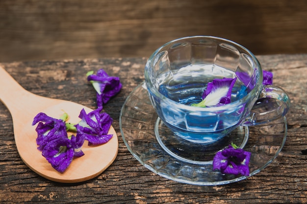 Asian pigeonwings or Butterfly Pea Heabal hot drinking tea refresh Thai herb drink on wood