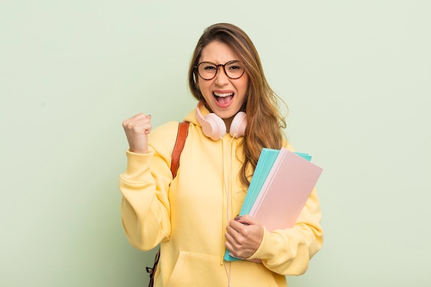 Asian pretty woman feeling shocked,laughing and celebrating success. university student concept