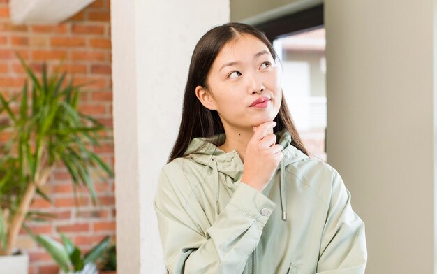 Asian pretty woman at new home interior