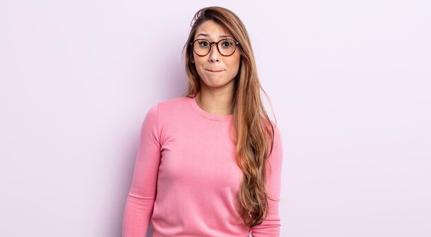 asian pretty woman with a goofy, crazy, surprised expression, puffing cheeks, feeling stuffed, fat and full of food