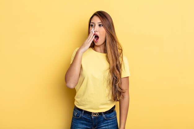 Asian pretty woman yawning lazily early in the morning, waking and looking sleepy, tired and bored