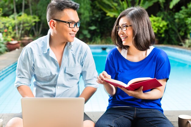 Asian prosperous couple in the garden