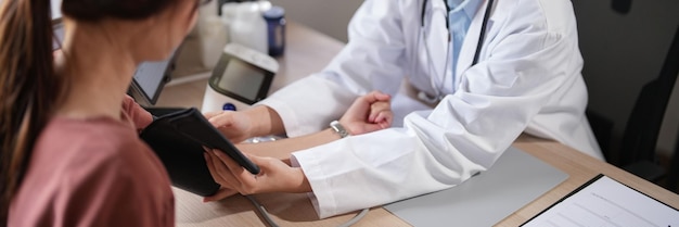 Asian psychologist women touching to encouraging patient and giving counseling about medicine and mental health therapy while female patient stressed and anxiety with psychological health problem