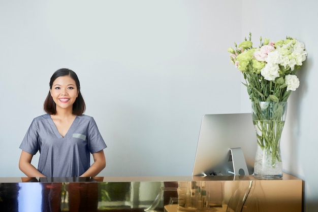 Asian receptionist in spa salon