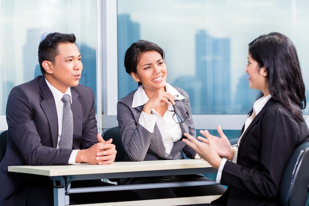 Asian recruitment team hiring candidate in job interview | Premium Photo
