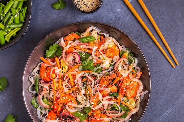 Asian salad with rice noodles shrimp and vegetables