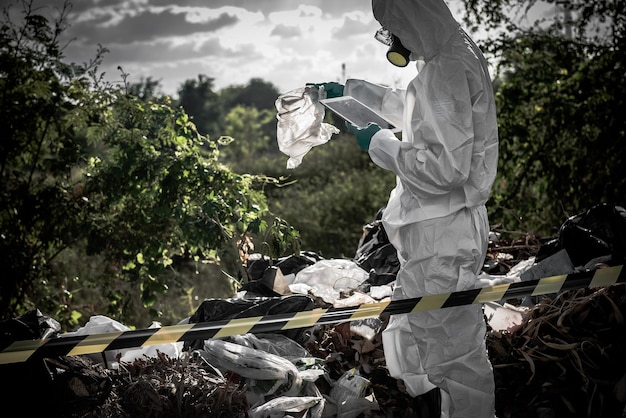 Asian scientist wear Chemical protection suit check danger chemicalworking at dangerous zoneCollecting samples in case of Corona virus investigation outbreaked from China