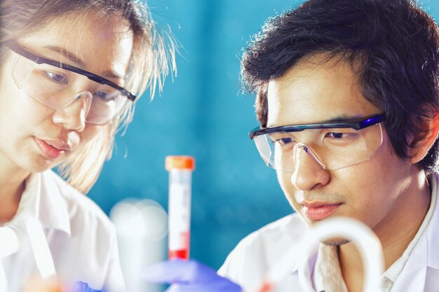 asian scientists working in laboratory