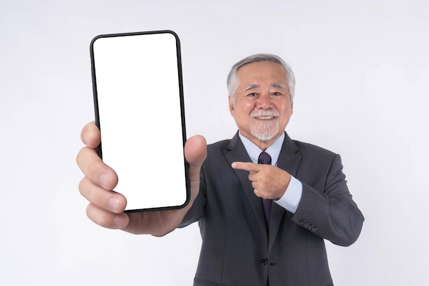 Asian senior businessman old man with suit feel happy good health showing big smart phone with blank screen white screen isolated on white background Mock Up Image