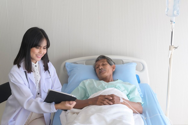 Asian senior male patient is consulting and visiting doctor in hospitalx9xA