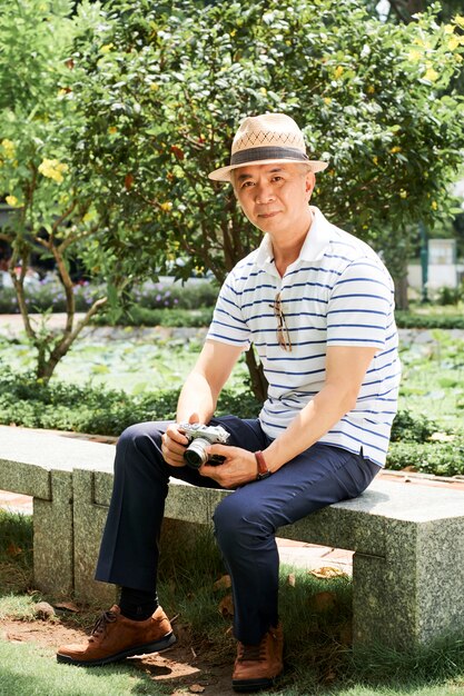 Asian senior man sitting outdoor