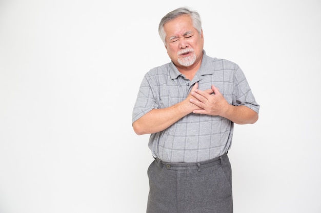 asian senior man with pain on heart isolated on white background.
