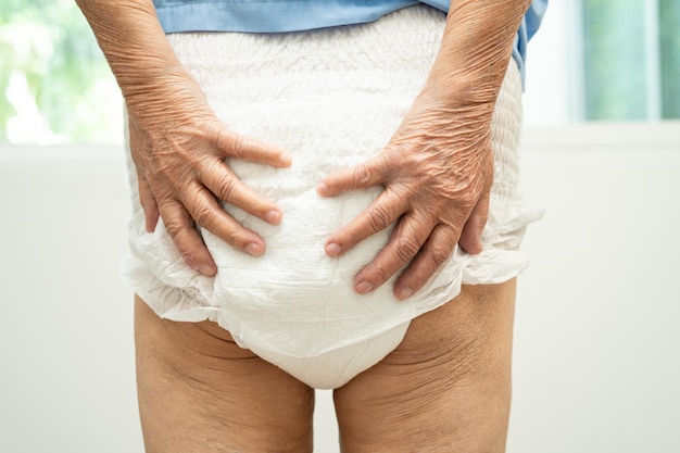 Asian senior woman patient wearing incontinence diaper in hospital healthy strong medical concept