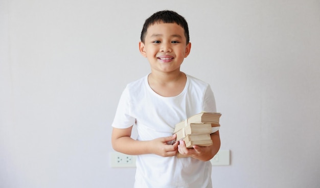 Asian smile boy hand holding money saving money financial planning