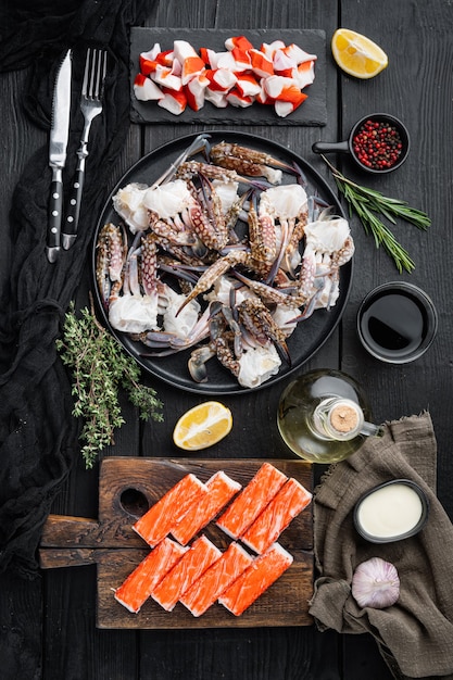 Asian snack surimi set, on black wooden table table, top view flat lay