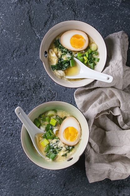 Asian soup with eggs, onion and spinach