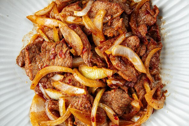 Asian spicy roast meat with onion