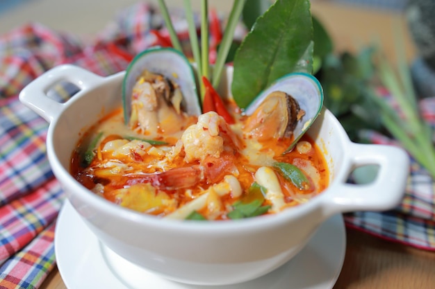 Asian Spicy soup with shrimp in bowl famous Thai food cuisine calling Tom Yum Kung