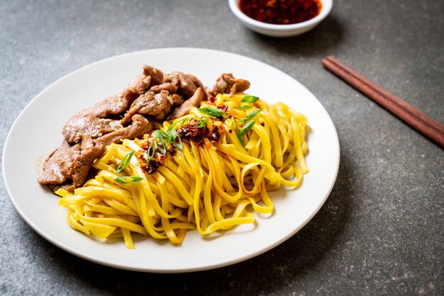 Asian stir-fried noodle with pork