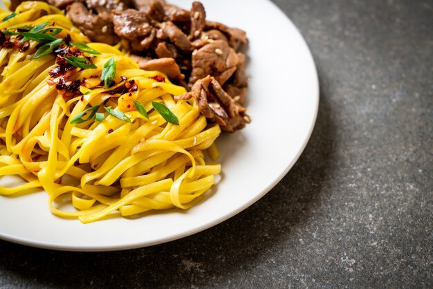 Asian stir-fried noodle with pork