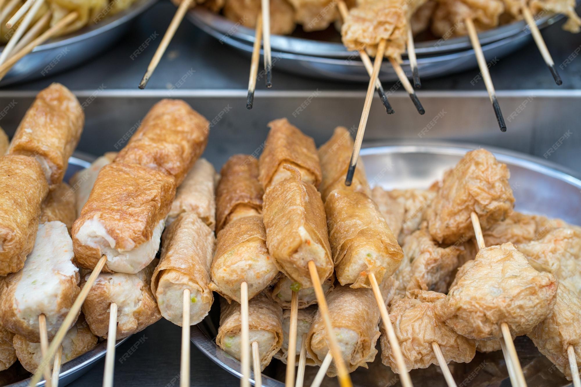 Premium Photo | Asian street food lok lok meat and fish cakes on skewers
