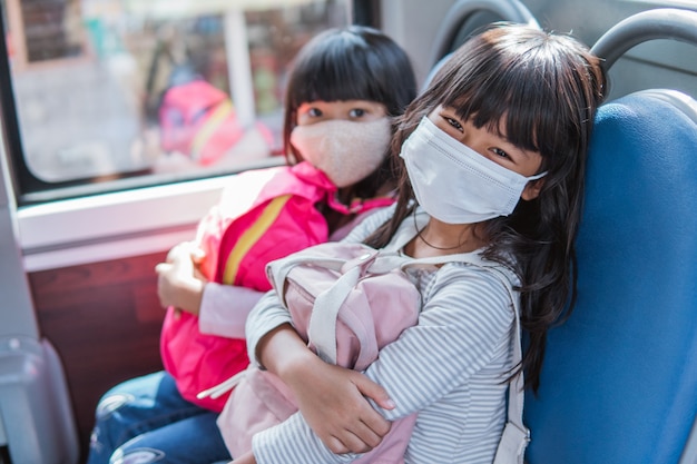 Asian student going to school together by public transport