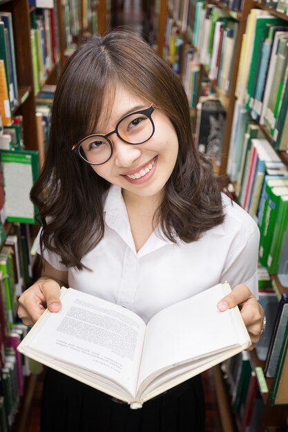 Asian student in library