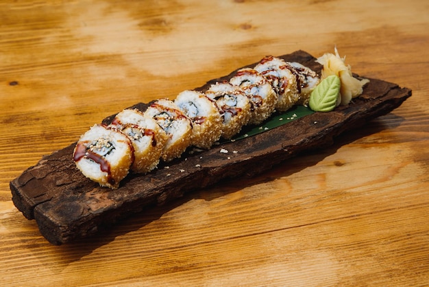 Asian sushi on wooden board