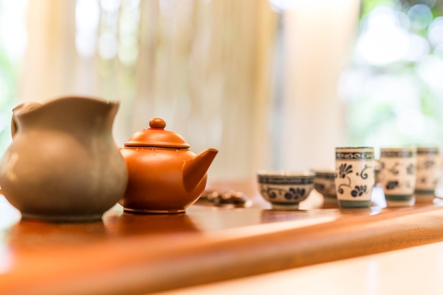 Asian tea set on bamboo wooden background. Traditional Chinese tea ceremony accessories