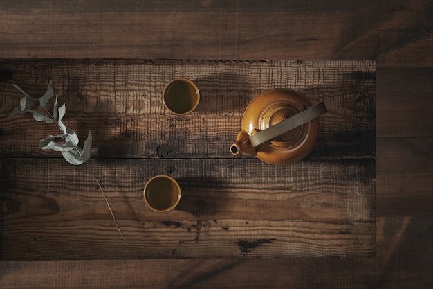 Asian tea set on a wooden table.