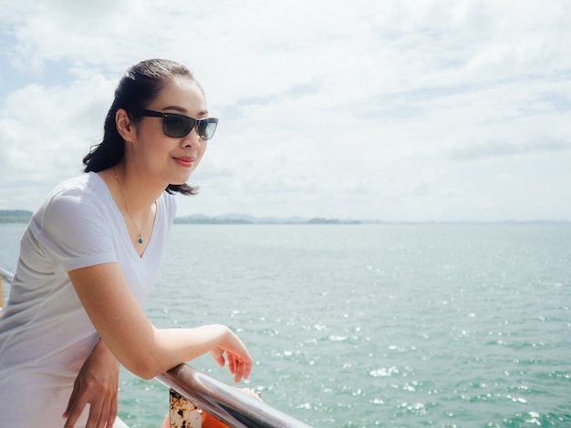 Asian tourist woman on the ferry is on the way for sea trip