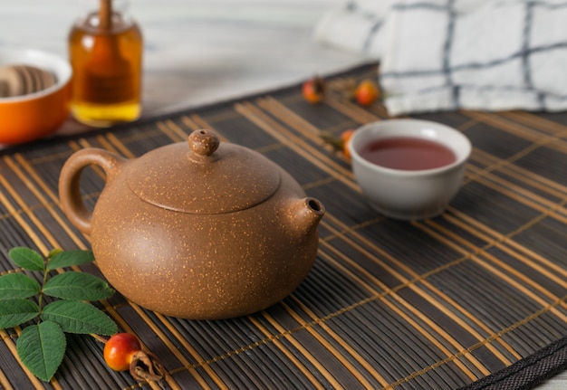 Asian traditional tea pot with healthy natural herbal tea