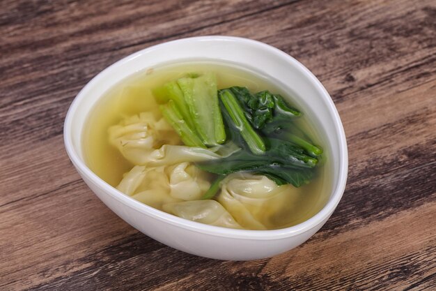 Asian traditional Wonton soup with herbs