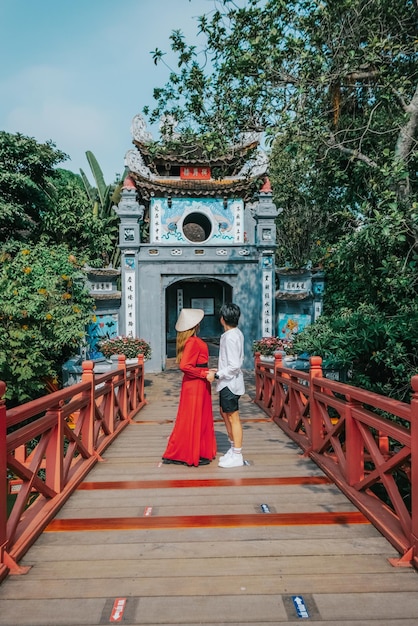 Asian travel to The Huc bridge entrance to Ngoc Son temple on Hoan Kiem lake Hanoi Vietnam