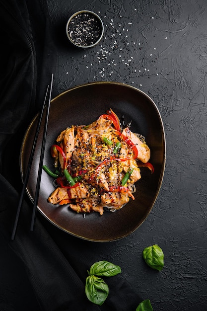 Asian udon noodles with chicken vegetables and teriyaki sauce