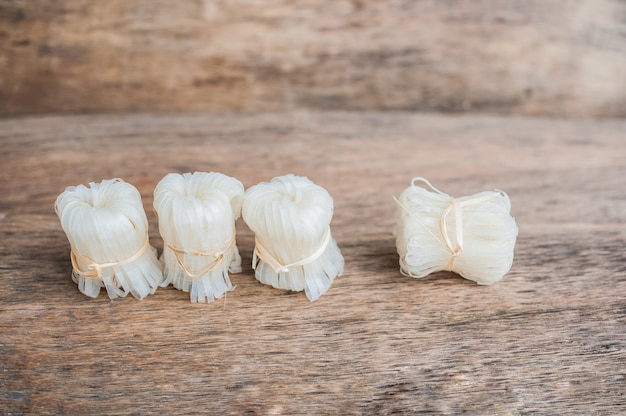 Asian uncooked noodles tied with natural rope