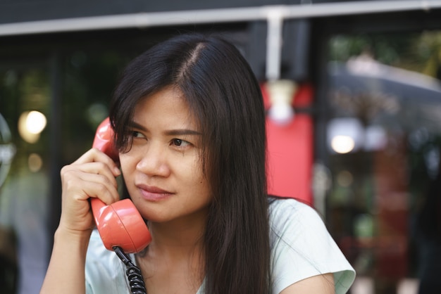 Asian woman angry on phone