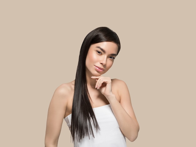 Asian woman beauty healthy skin care and beautiful hair female model portrait Color background brown