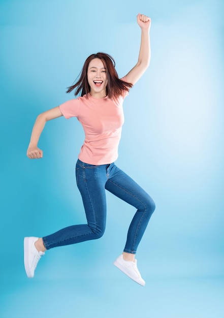 Asian woman on blue background