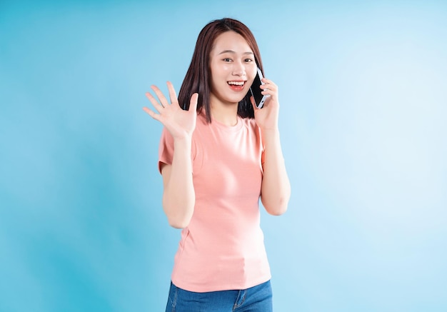 Asian woman on blue background