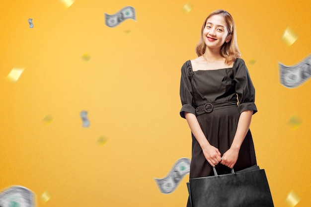 Asian woman carrying a shopping bag