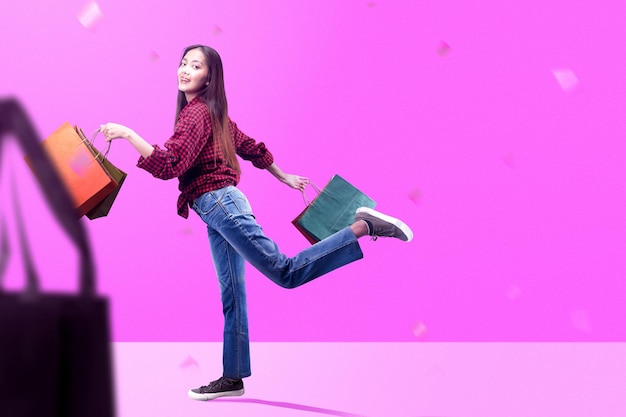 Asian woman carrying a shopping bag