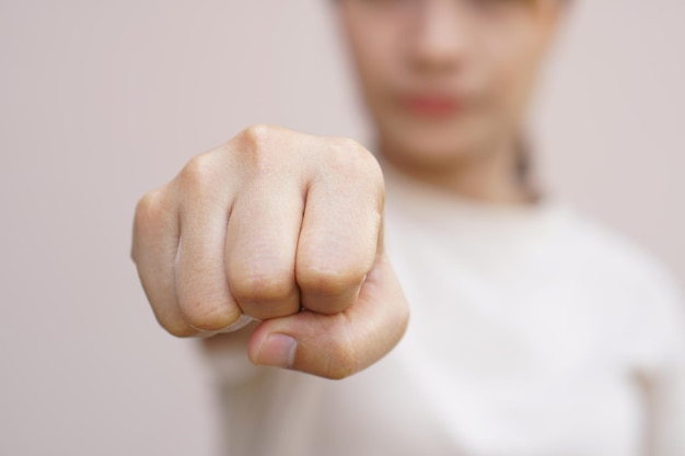 Asian woman clenching her fist