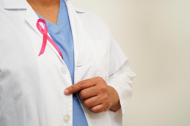 Asian woman doctor with pink ribbon World Breast Cancer Day at October