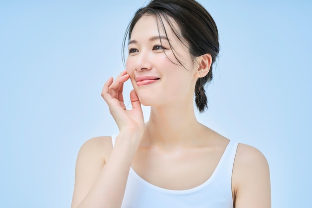 asian woman doing skin care